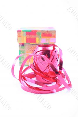 red ribbon and colorful box