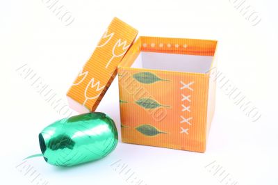 green ribbon and colorful box