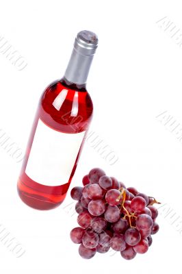 Wine bottle and grapes bunch