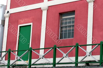 Pink Stucco and Green Door