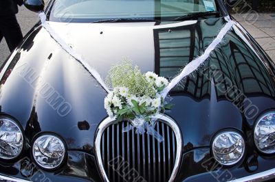 bouquet on wedding car
