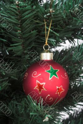 Red christmas ball over a tree