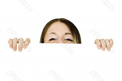 beautiful teenager peeping over a banner