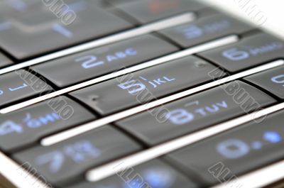 Close up shot of mobile keypad under light