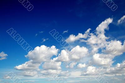 Blue sky with cotton like clouds