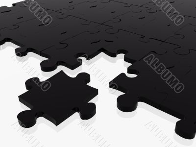 black puzzle with piece missing