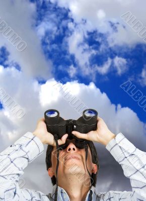 business man with binoculars over sky