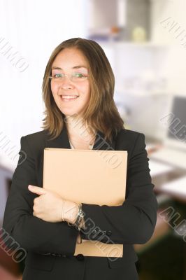 business woman in her office holding a folder
