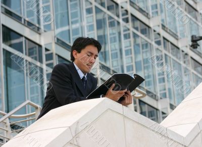 business man reading mag - andres