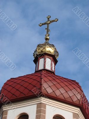 Orthodox Church with red Cupola with Holy Cross