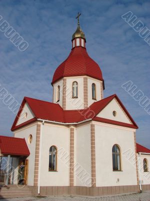 Orthodox Church with red Cupola with Holy Cross