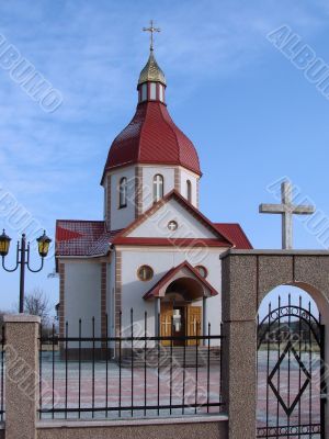Orthodox Church with red Cupola with Holy Cross