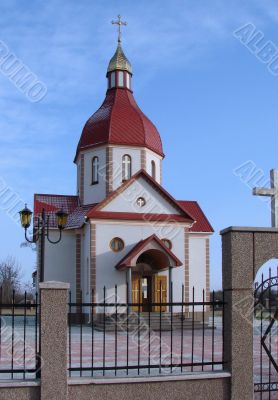 Orthodox Church with red Cupola with Holy Cross
