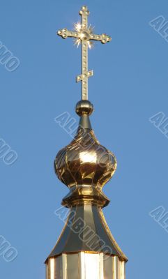 Orthodox Church`s Cupola Cross upon blue sky