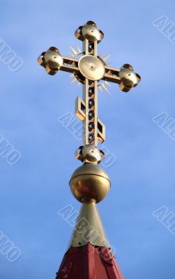 Orthodox Church`s Cupola Cross upon blue sky
