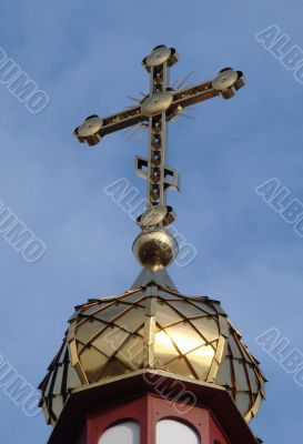 Orthodox Church`s Cupola Cross upon blue sky