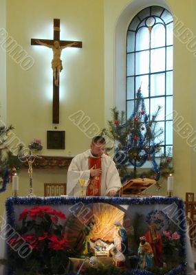 Roman catholic pastor praying inside dome