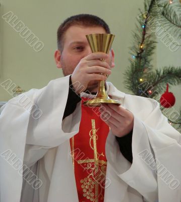 Roman catholic pastor praying inside dome
