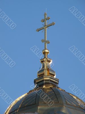 Orthodox Church`s Cupola Cross upon blue sky