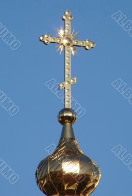 Orthodox Church`s Cupola Cross upon blue sky