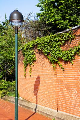 brick wall and lamppost