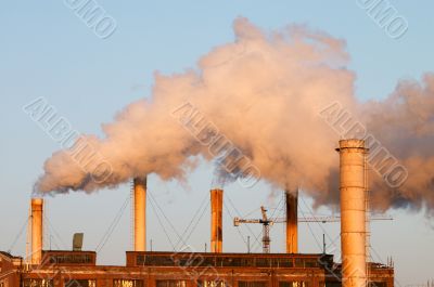Factory with smokestacks
