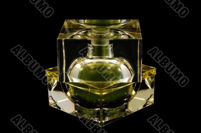 Bottle of perfume over black background