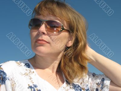 Woman touches her hairs