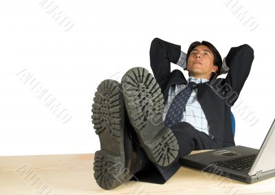 business man with his feet up