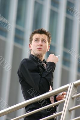 business man smoking - aris