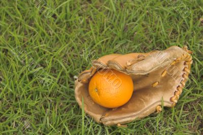 An Orange in a Baseball Glove