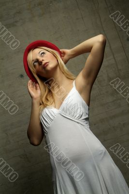 standing woman with hat