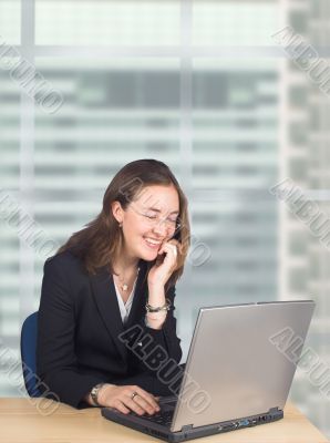 business woman on laptop in her office