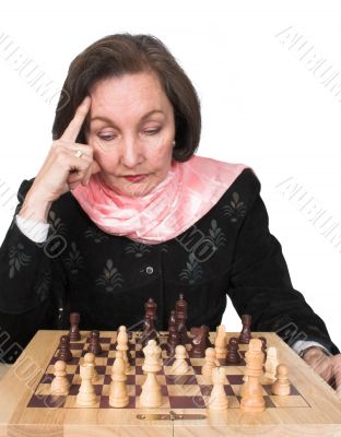 business woman planning her next move - chess