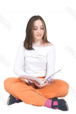 beautiful girl reading on the floor