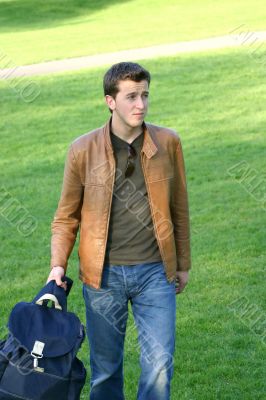casual student holding his bag