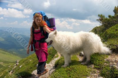 Backpacker girl with samoyed dog