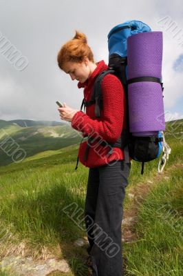 Backpacker girl with phone