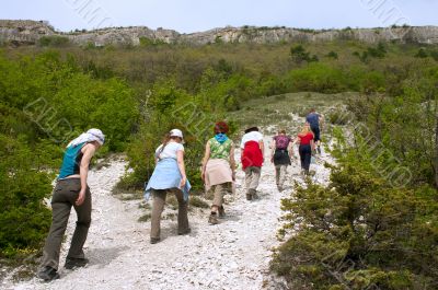 tourists on excursion in mountains