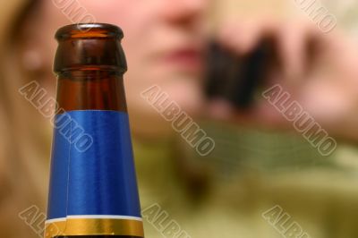 bottle neck with blured woman face