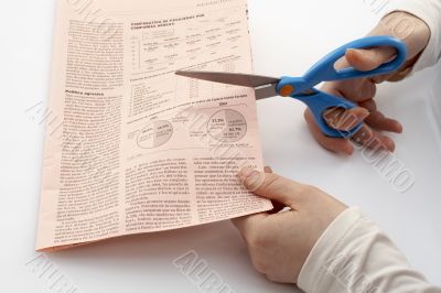 Scissors cutting paper