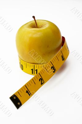 Yellow Apple with tape measure