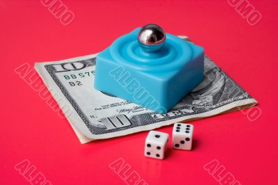 dices and marble steel over ten dollar bill