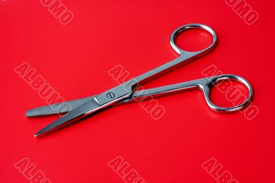 scissors on a red background