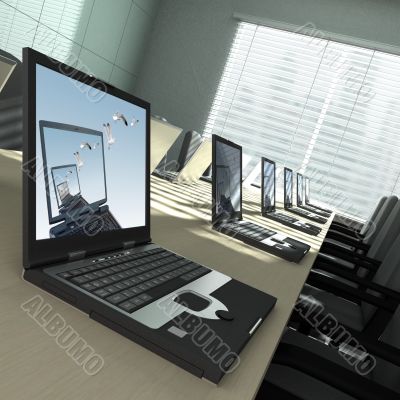 Laptops in an empty room