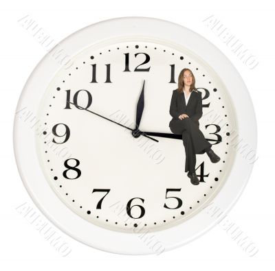 business woman sitting on clock