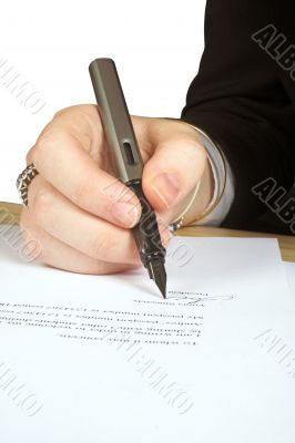 business woman signing a letter
