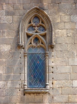 Ancient window of a cathedral . Barcelona