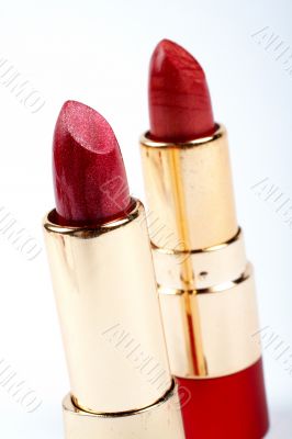 Two tubes of red lipstick