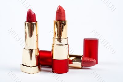 Three tubes of red lipstick